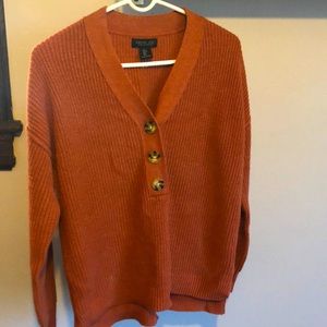 Coral sweater with turtle buttons